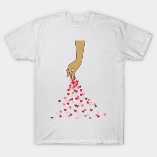 Hand sprinkling red and pink hearts, spread a hopefull message of love and care for each other! Warming T-Shirt